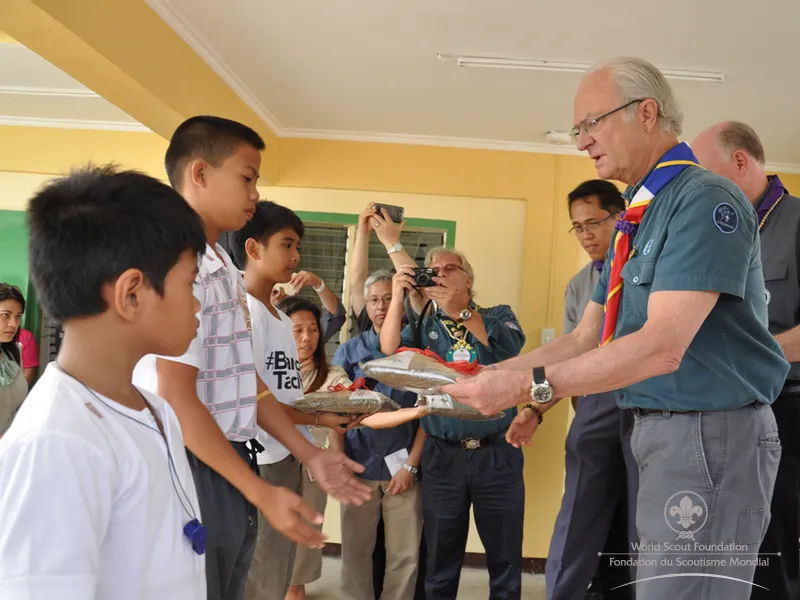 Handing out unforms to the Scouts of Tacloban who lost all in the disaster
