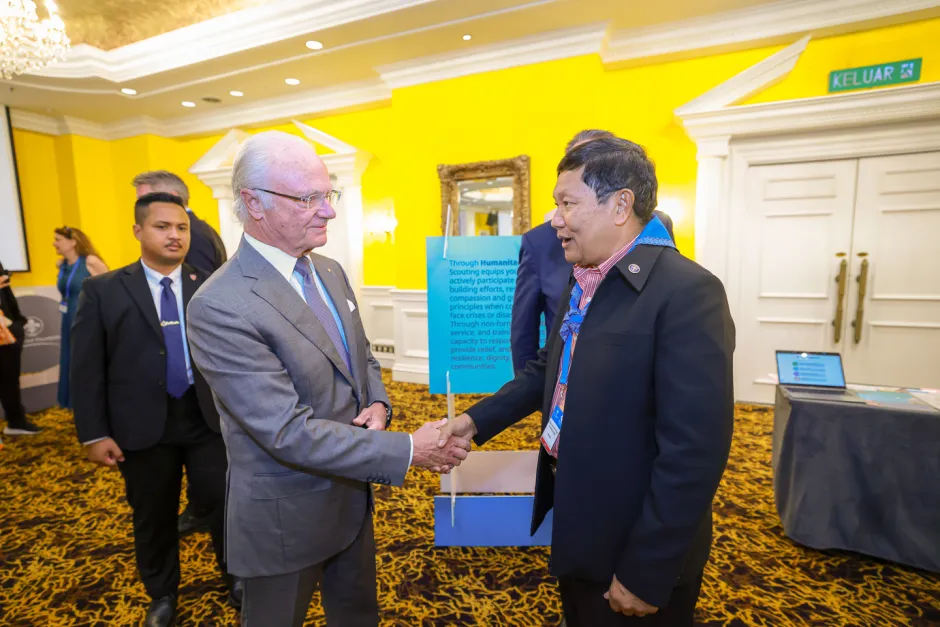 His Majesty shaking hands